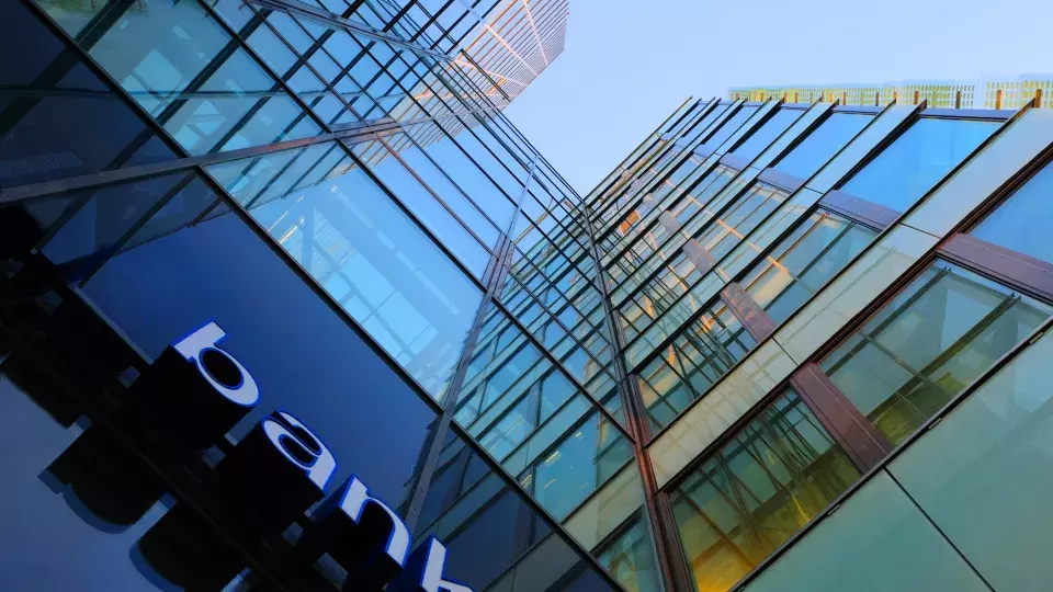 View of bank buildings from the street looking up