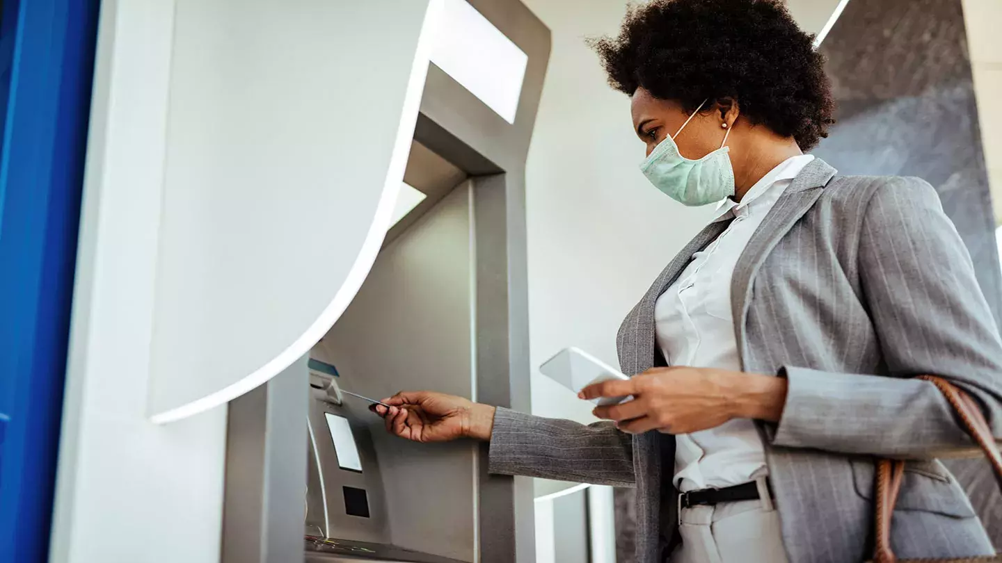 Woman using the ATM